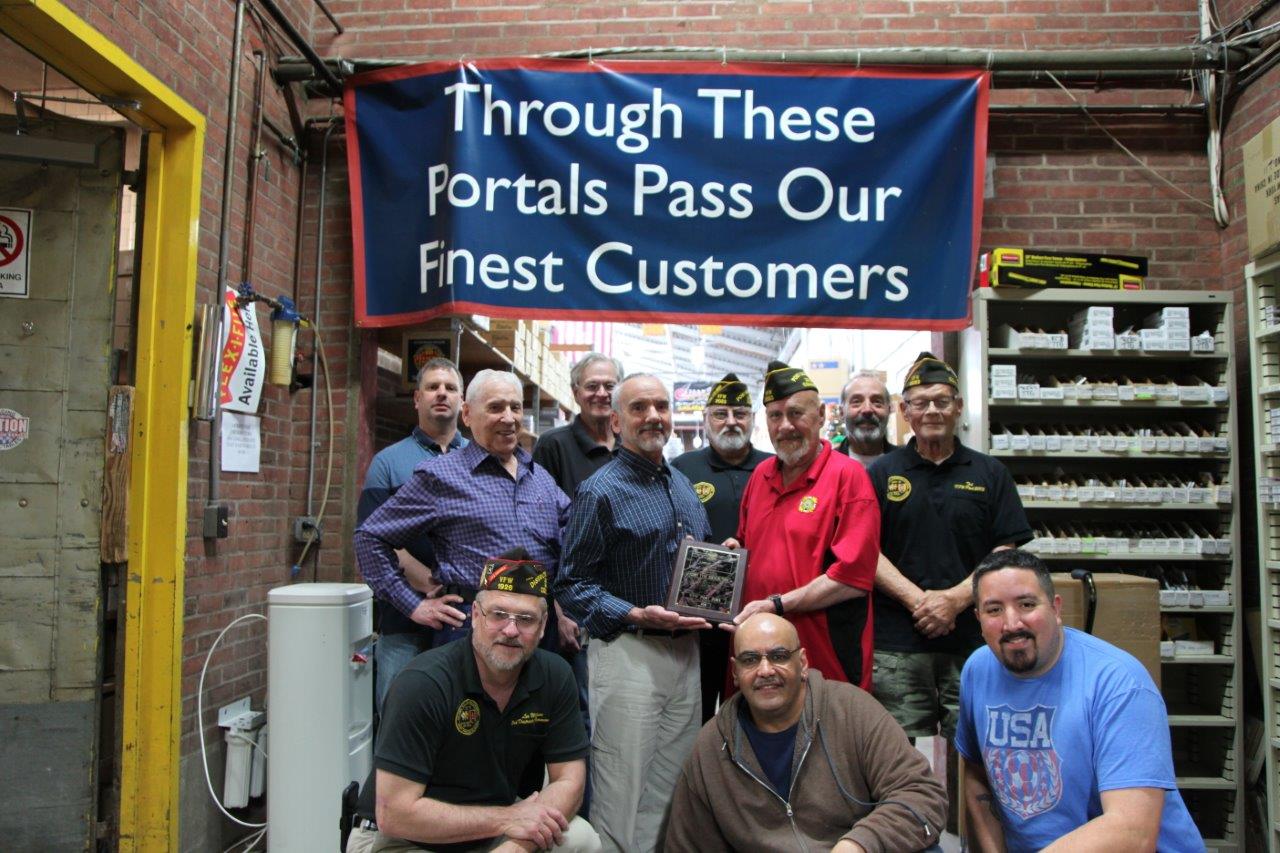 A plaque was presented to HobbyTyme Distributors by members of VFW Post 2083, East Hartford CT.