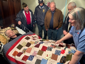 Presentation of a Quilt of Valor to Vinny Parys at his home on 2 January 2023.